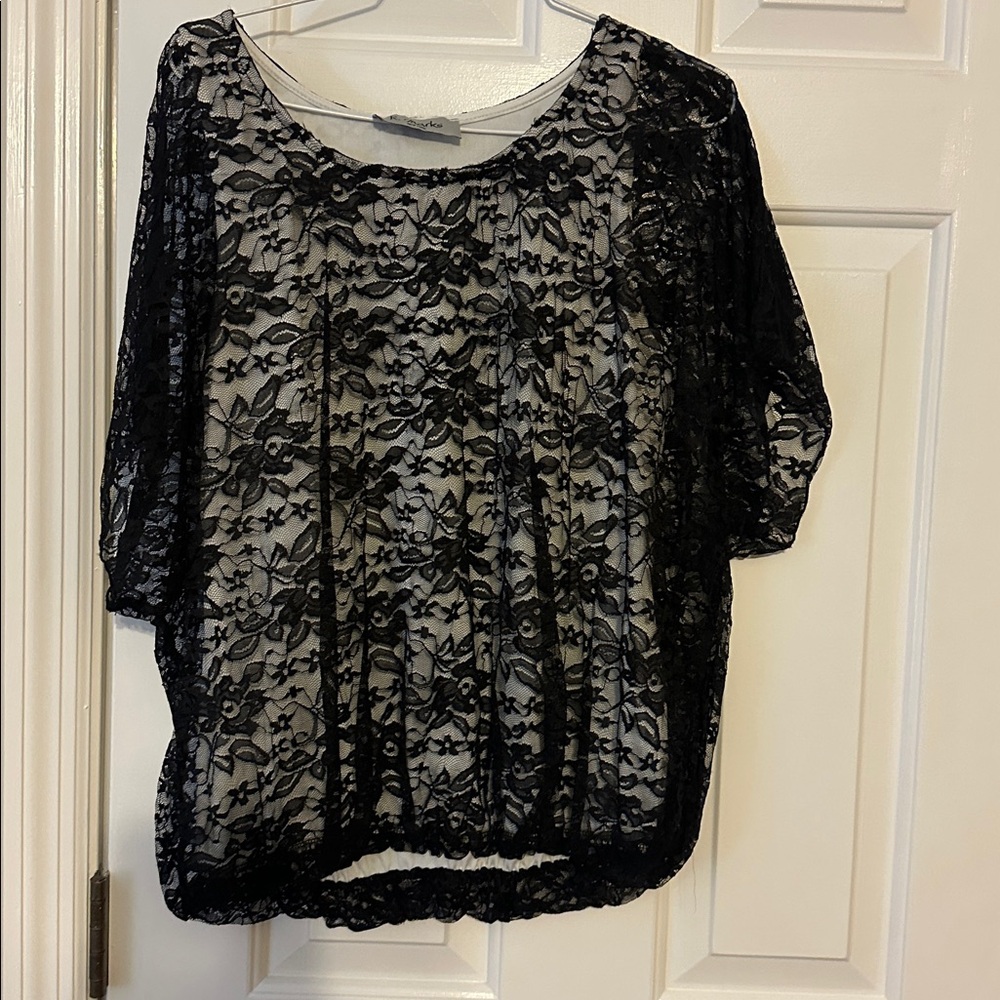 Black with white tank sewn in….beautiful top
Large